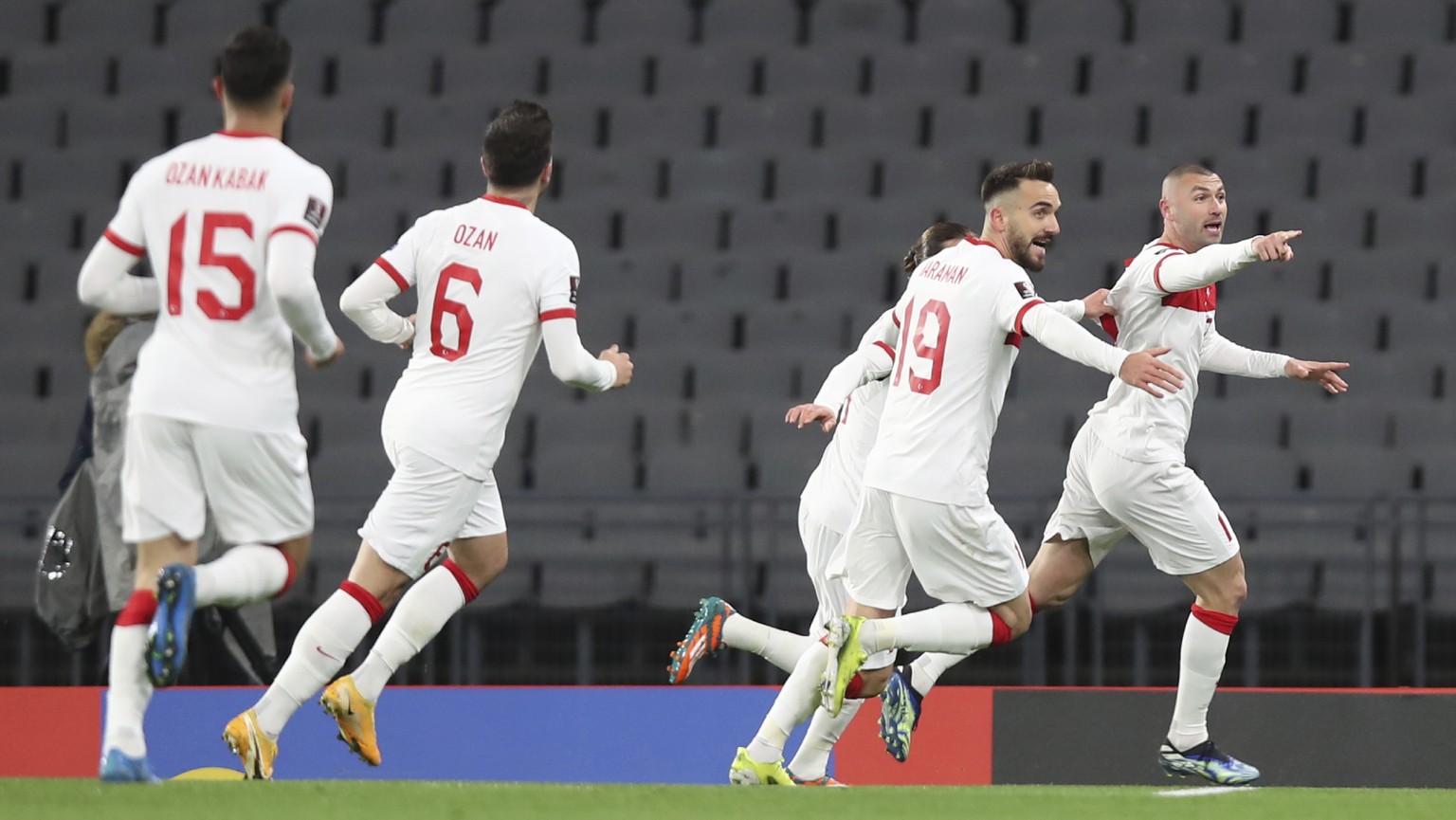 Turkey&#039;s Burak Yilmaz, right, celebrates after scoring his side&#039;s opening goal during the World Cup 2022 group G qualifying soccer match between Turkey and Netherlands at the Ataturk Olimpiy ...