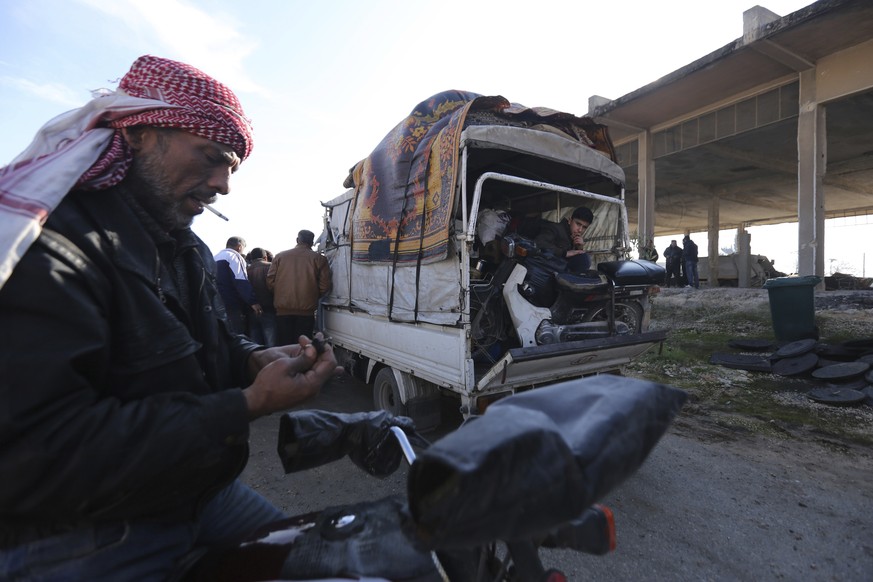A truck carries civilians fleeing Maaret al-Numan, Syria, ahead of a government offensive Sunday, Dec. 22, 2019. Syrian government forces pushed deeper in their offensive on the last remaining rebel s ...