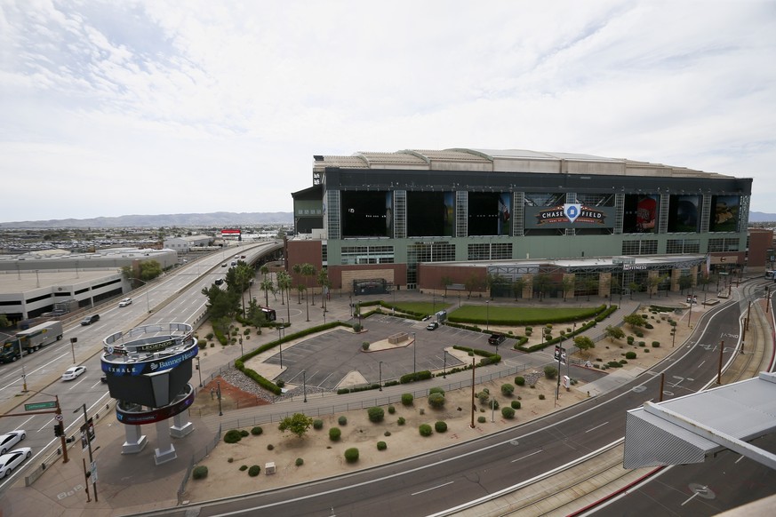 Very little activity is evident in front of Chase Field Thursday, March 26, 2020, in Phoenix. The Arizona Diamondbacks would have hosted the Atlanta Braves in their season-opening baseball game Thursd ...