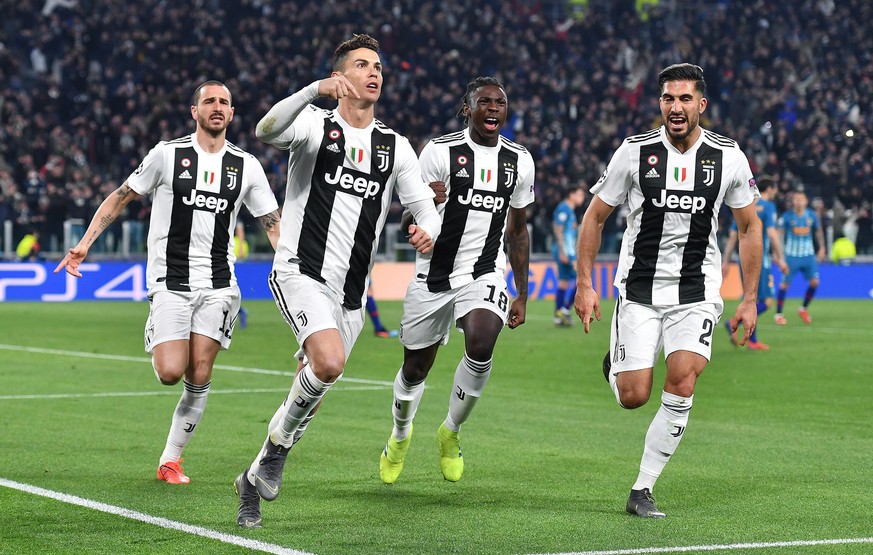 epa07432518 Juventus&#039; Cristiano Ronaldo (2L) jubilates with his teammates after scoring on penalty the goal (3-0) during the UEFA Champions League round of 16 second leg soccer match between Juve ...