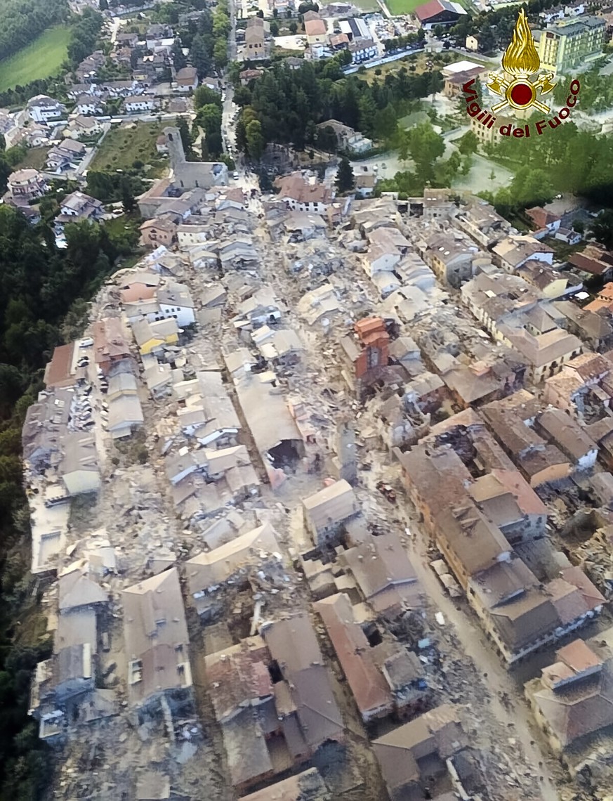 This aerial view shows the damage in the town of Amatrice, central Italy, Wednesday, Aug. 24, 2016 following an earthquake. A strong earthquake rocked central Italy early Wednesday, collapsing homes o ...