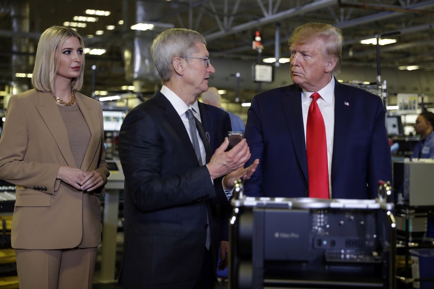 President Donald Trump tours an Apple manufacturing plant, Wednesday, Nov. 20, 2019, in Austin with Apple CEO Tim Cook, left, and Ivanka Trump, the daughter and adviser of President Donald Trump. (AP  ...