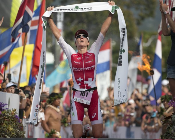 Daniela Ryf, of Switzerland, reacts after winning the Ironman World Championship Triathlon, Saturday, Oct. 14, 2017, in Kailua-Kona, Hawaii. (AP Photo/Marco Garcia)