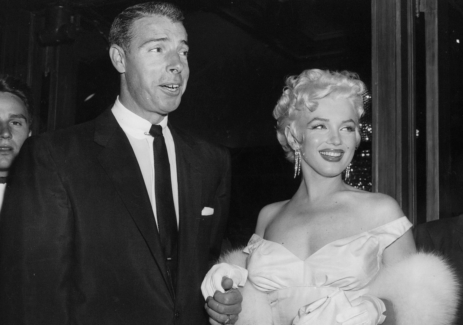 FILE - In this June 2, 1955 file photo, actress Marilyn Monroe, right, dressed in a glamorous evening gown, arrives with Joe DiMaggio at the theater. Monroe&#039;s Lost Archives are coming to light no ...