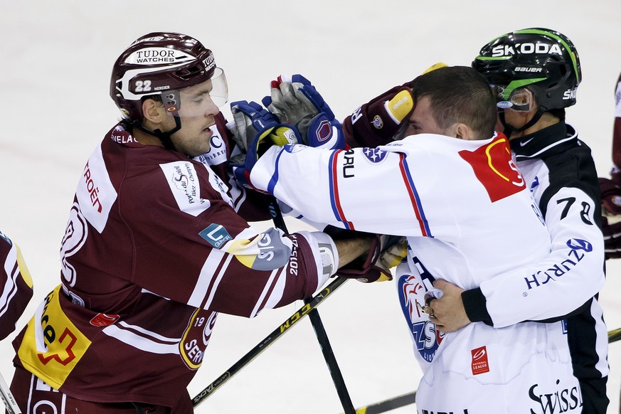 Geneve-Servette&#039;s Jonathan Mercier, left, fights with Lions&#039; Patrik Baertschi, right, during the game of National League A (NLA) Swiss Championship between Geneve-Servette HC and ZSC Lions,  ...