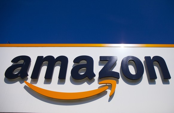 FILE - In this April 16, 2020, file photo, the Amazon logo is displayed in Douai, northern France. Amazon said Tuesday, May 18, 2021, that it will continue to ban police use of its face-recognition te ...