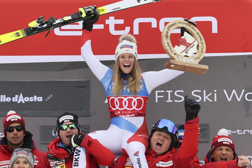 Switzerland&#039;s Corinne Suter celebrates with her team after taking third place in an alpine ski, women&#039;s World Cup Super G, in La Thuile, Italy, Saturday, Feb. 29, 2020. (AP Photo/Alessandro  ...