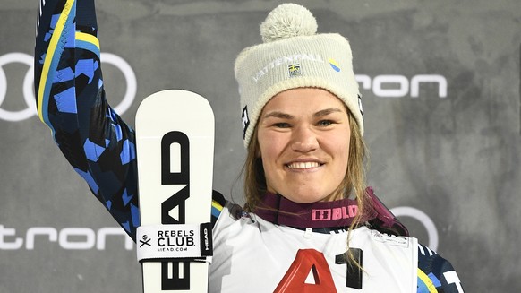 epa08128634 Second placed Anna Swenn Larsson of Sweden celebrates on the podium after the Women&#039;s Slalom night race at the FIS Alpine Skiing World Cup in Flachau, Austria, 14 January 2020. EPA/CH ...