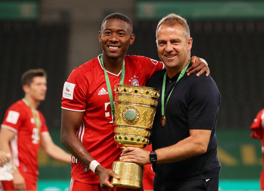 epa08527813 Bayern Munich&#039;s head coach Hansi Flick (R) and David Alaba (L) pose with the trophy after winning the German DFB Cup final between Bayer 04 Leverkusen and FC Bayern Munich at Olympic  ...