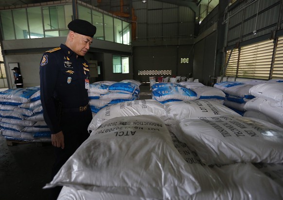 epa08816062 A handout photo made available by the Office of Narcotics Control Board (ONCB) shows the secretary-general of the ONCB, Wichai chaimongkhon inspect after seized Ketamine inside a warehouse ...