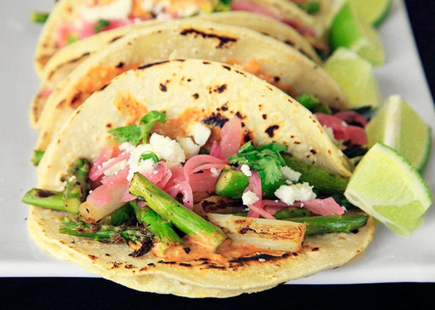 Charred Asparagus Tacos With Creamy Adobo and Pickled Red Onions http://www.seriouseats.com/recipes/2012/05/charred-asparagus-tacos-with-creamy-adobo-and-pickled-red-onions-recipe.html