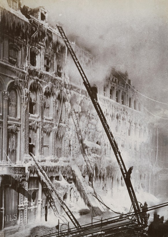Sub-zero conditions cause the water to freeze upon impact, as firemen battle a blaze in Montreal, January 1889. (Photo by Sean Sexton/Getty Images)