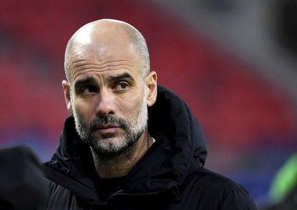 Manchester City&#039;s head coach Pep Guardiola reacts after a Champions League round of 16 second leg soccer match between Manchester City and Borussia Moenchengladbach at the Puskas Arena in Budapes ...