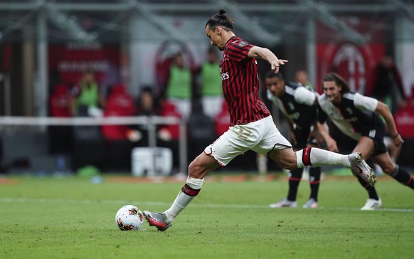 AC Milan&#039;s Zlatan Ibrahimovic scores from the penalty spot his side&#039;s opening goal during the Serie A soccer match between AC Milan and Juventus at the Milan San Siro Stadium, Italy, Tuesday ...