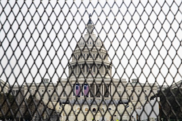 epa08931839 New security fencing surrounds the US Capitol in Washington, DC, USA, 11 January 2021. Speaker of the House Nancy Pelosi plans to introduce articles of impeachment against US President Don ...