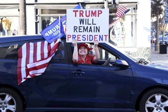 Trump supporters parade along the Rose Parade route on Colorado Blvd in Pasadena, Calif., on Friday, Jan. 1, 2021. (Keith Birmingham/The Orange County Register via AP)
