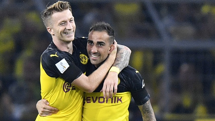 Dortmund&#039;s Paco Alcacer, second left, celebrates with Dortmund&#039;s Marco Reus after scoring his side&#039;s opening goal during the German Supercup final soccer match between Borussia Dortmund ...