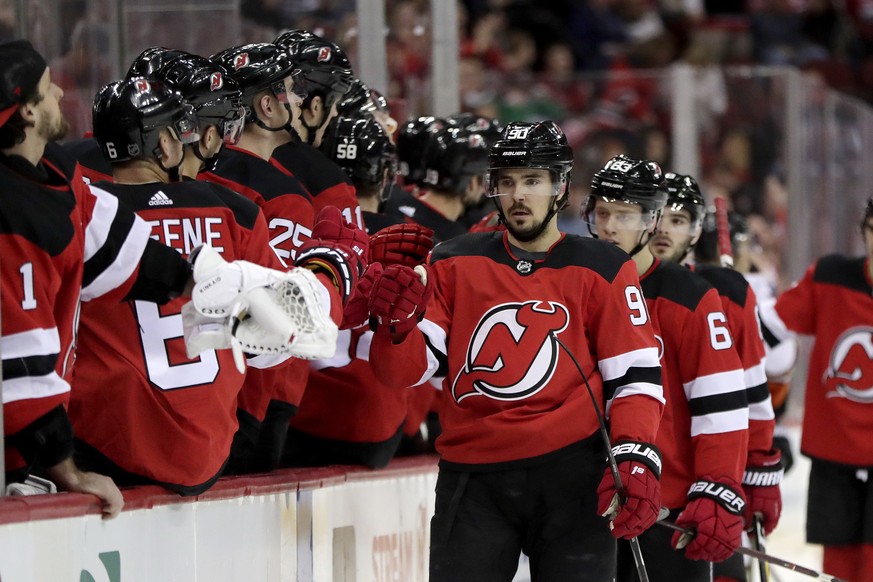 New Jersey Devils left wing Marcus Johansson, center, of Sweden, skates by his bench after scoring a goal on the Anaheim Ducks during the first period of an NHL hockey game, Saturday, Jan. 19, 2019, i ...