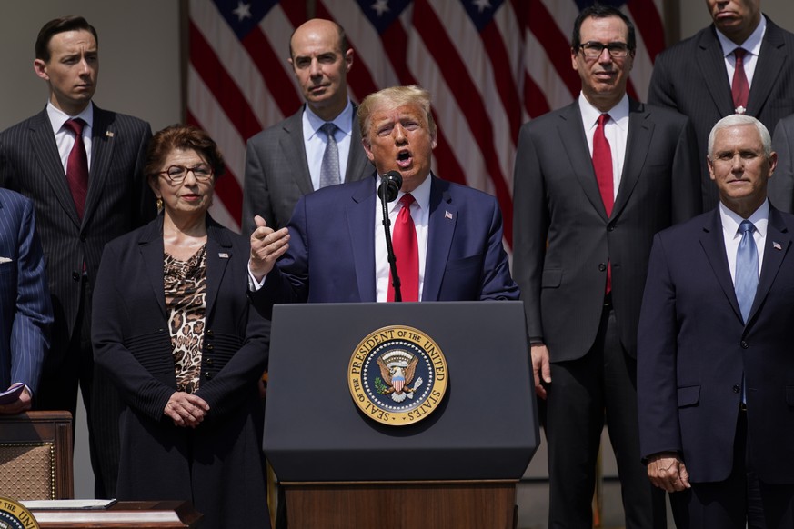 President Donald Trump speaks during a news conference in the Rose Garden of the White House, Friday, June 5, 2020, in Washington. Front row from left, Small Business Administration administrator Jovi ...