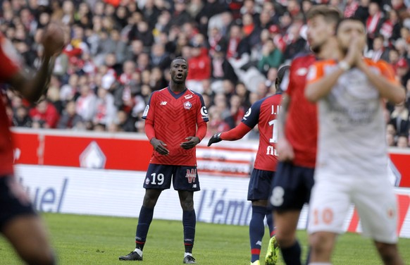 Lille&#039;s Nicolas Pepe, center, reacts during his League One soccer match match Lille and Montpellier at the Lille Metropole stadium, in Villeneuve d&#039;Ascq, northern France, Sunday, Feb. 17, 20 ...