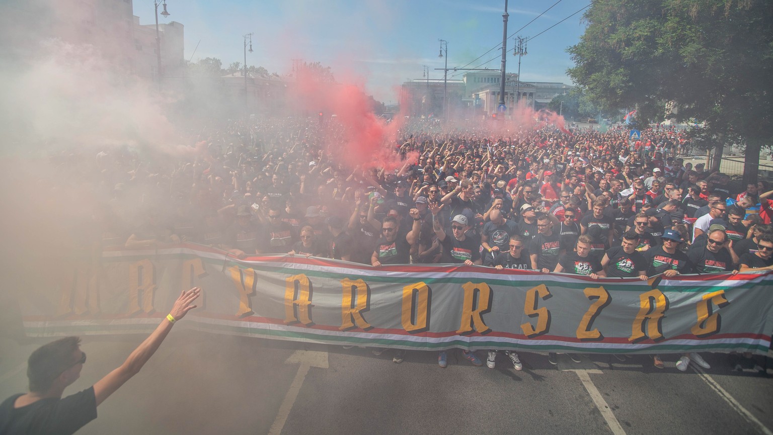 epa09273155 Hungarian fans march towards the Puskas Arena in Budapest, Hungary, 15 June 2021, just hours before Hungary will face Portugal in their UEFA EURO 2020 group F preliminary round soccer matc ...