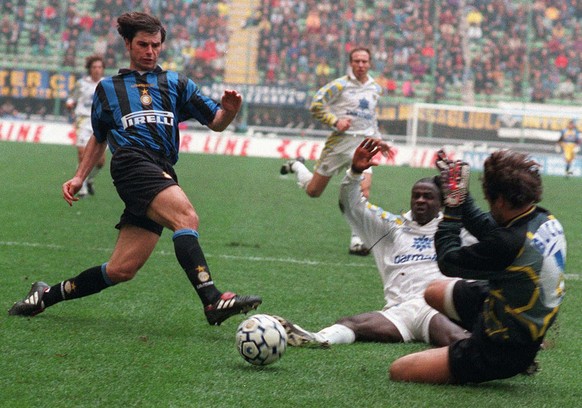 Inter Milan&#039;s Swiss forward Ciriaco Sforza kicks the ball as Parma&#039;s goalie Luca Bucci tries to stop him, during their Italian first division soccer game, at the Milan San Siro stadium, Sund ...