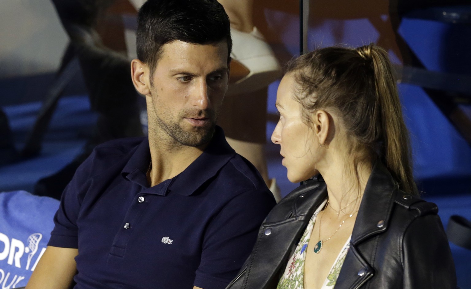 epa08503559 (FILE) - Novak Djokovic of Serbia (L) talks with his wife Jelena (R) at the Adria Tour tennis tournament in Belgrade, Serbia, 14 June 2020 (reissued 23 June 2020). According to media repor ...