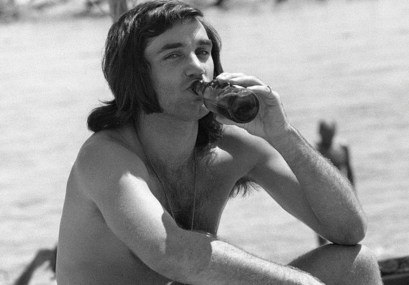 Former Manchester United and Northern Ireland soccer star George Best sits on the beach at Marbella, Spain, in this May 25, 1972 file photo. Soccer great Best is &quot;desperately ill&quot; but hangin ...