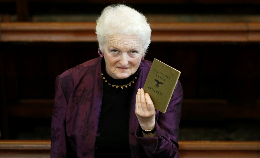 London rabbi Julia Neuberger poses for a photograph with the old German passport of her grandmother, Hermine Sara Rosenthal, at the West London Synagogue in London, Britain September 20, 2016. REUTERS ...