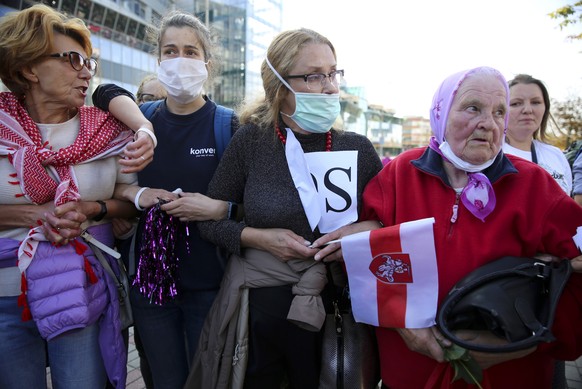 Women attend an opposition rally to protest the official presidential election results in Minsk, Belarus, Saturday, Sept. 19, 2020. Daily protests calling for the authoritarian president&#039;s resign ...