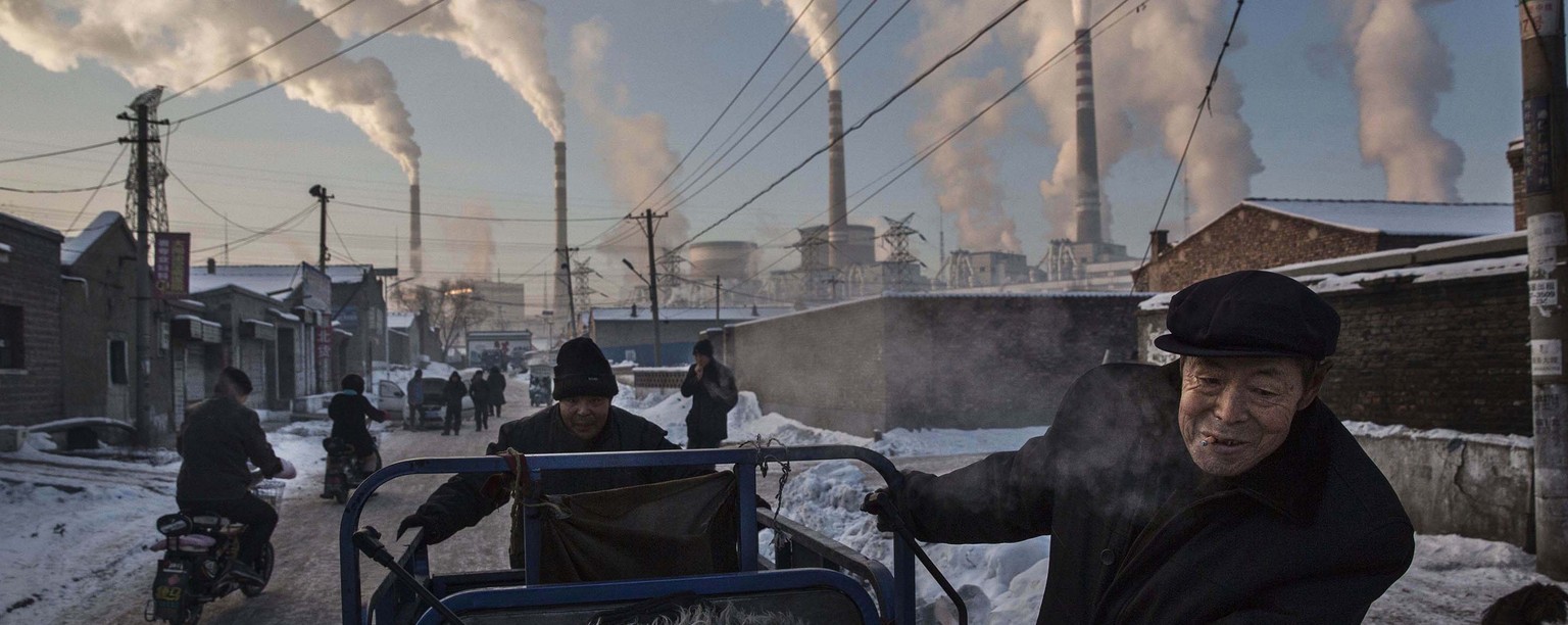 In this image released by World Press Photo titled &quot;China&#039;s Coal Addiction&quot; by photographer Kevin Frayer for Getty Images which won first prize in the Daily Life singles category shows  ...