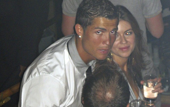 In this June 2009 photo made available to the Associated Press on Friday Oct. 5, 2018, soccer star Cristiano Ronaldo is pictured with Kathryn Mayorga in Rain Nightclub in Las Vegas. A lawyer for Mayor ...