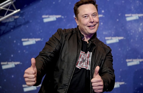 FILE - In this Tuesday, Dec. 1, 2020 file photo, SpaceX owner and Tesla CEO Elon Musk arrives on the red carpet for the Axel Springer media award, in Berlin, Germany. Technology mogul Elon Musk has a  ...