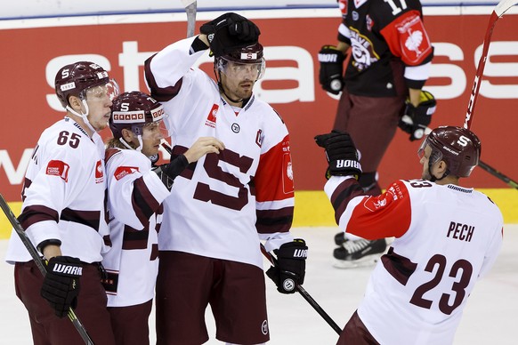 Sparta&#039;s Tomas Netik, 2nd left, celebrates his goal withe teammates Michal Cajkovsky, left, Petr Kumstat, 2nd right, and Lukas Pech, right, after scored the 0:1, during the Champions Hockey Leagu ...