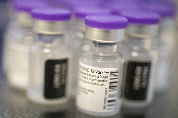 Vials of Pfizer-BioNTech COVID-19 vaccines are ready to be injected to medical staff at the Ichilov Hospital in Tel Aviv, Israel, Sunday, Dec. 20, 2020. (AP Photo/Ariel Schalit)