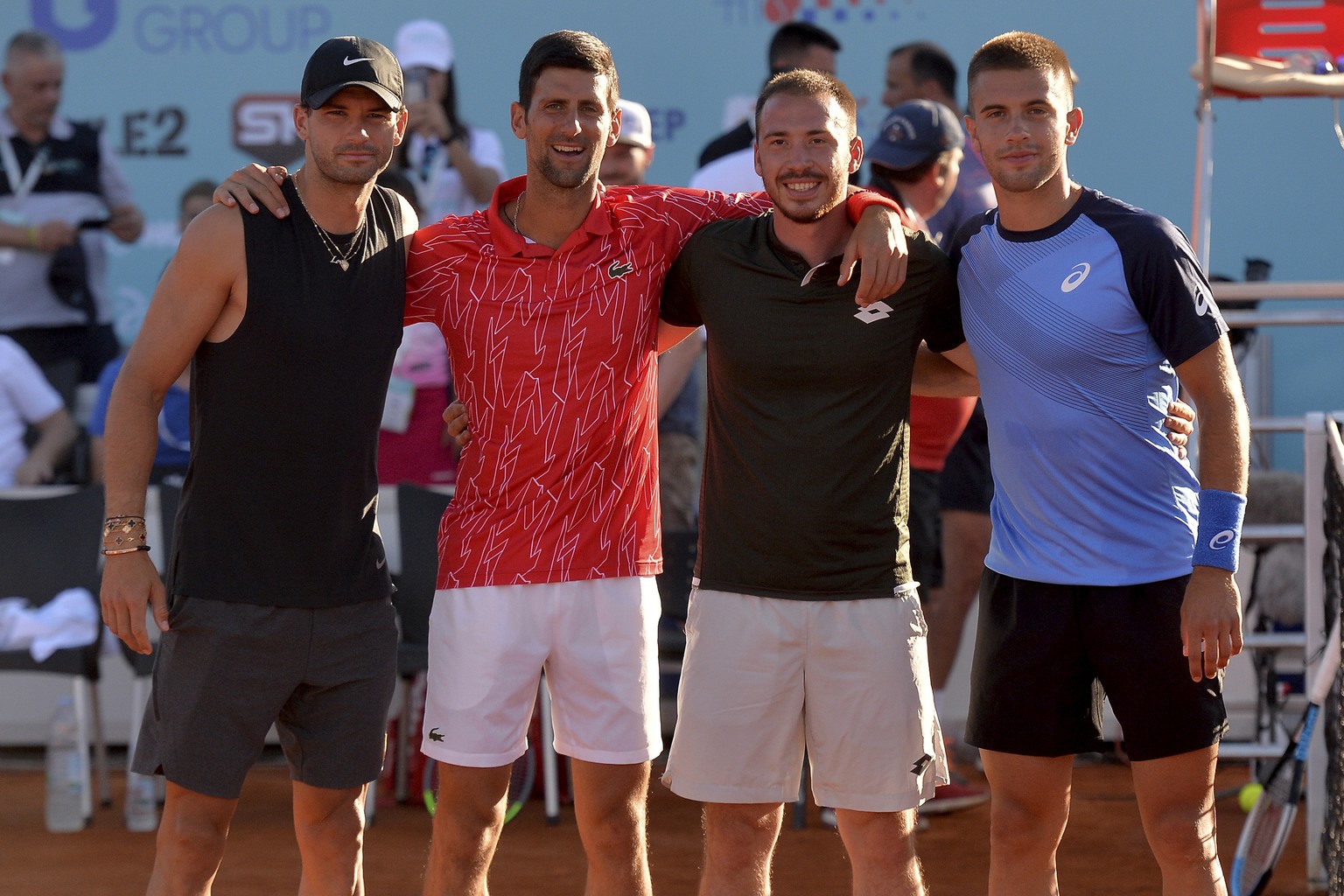 In this photo taken June 19, 2020, Serbian tennis player Novak Djokovic, second left, poses with Bulgaria&#039;s Grigor Dimitrov, left, Serbia&#039;s Viktor Troicki and Croatia&#039;s Borna Coric, rig ...