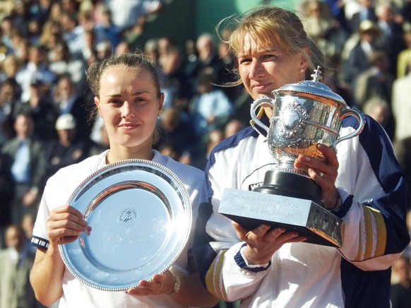 Sixth-seeded Steffi Graf of Germany, right, poses with the trophy after she defeated top-seeded Martina Hingis of Switzerland, left, 4-6, 7-5, 6-2 in during the women&#039;s final tennis match at the  ...