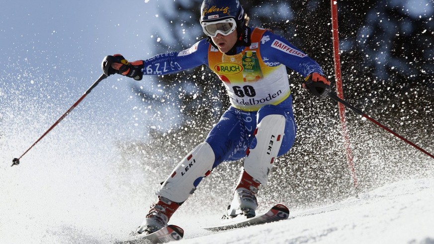 Swiss ski racer Marc Berthod clears a gate in the first run of the men&#039;s ski world cup slalom in Adelboden, Switzerland, Sunday, January 7, 2007. Berthod was 27th of the first run but won the rac ...