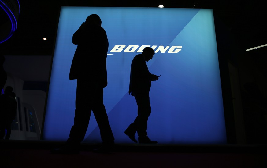 epa08003120 Visitors walk past the Boeing pavilion during the first day of the Dubai Airshow 2019 at Al Maktoum International Airport in Jebel Ali, Dubai, United Arab Emirates, 17 November 2019. The a ...