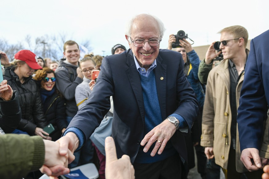 epa08188431 US Senator from Vermont Bernie Sanders works the crowd of supporters after addressing them during a field office meet and greet in Cedar Rapids, Iowa, USA, 2 February, 2020. The first-in-t ...