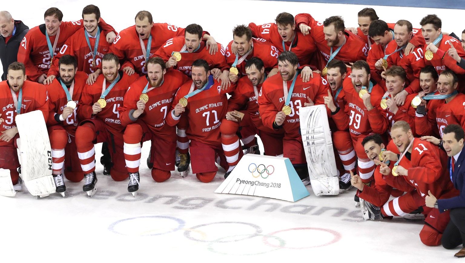 epa06563559 Gold medalists Olympic Athletes of Russia (OAR) react during the medal ceremony of the Men&#039;s Ice Hockey gold medal match between Olympic Athletes of Russia (OAR) and Germany at the Ga ...