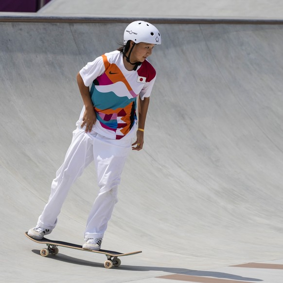 Momiji Nishiya of Japan, who won the gold medal, competes in the women&#039;s street skateboarding finals at the 2020 Summer Olympics, Monday, July 26, 2021, in Tokyo, Japan. (AP Photo/Ben Curtis)
Mom ...