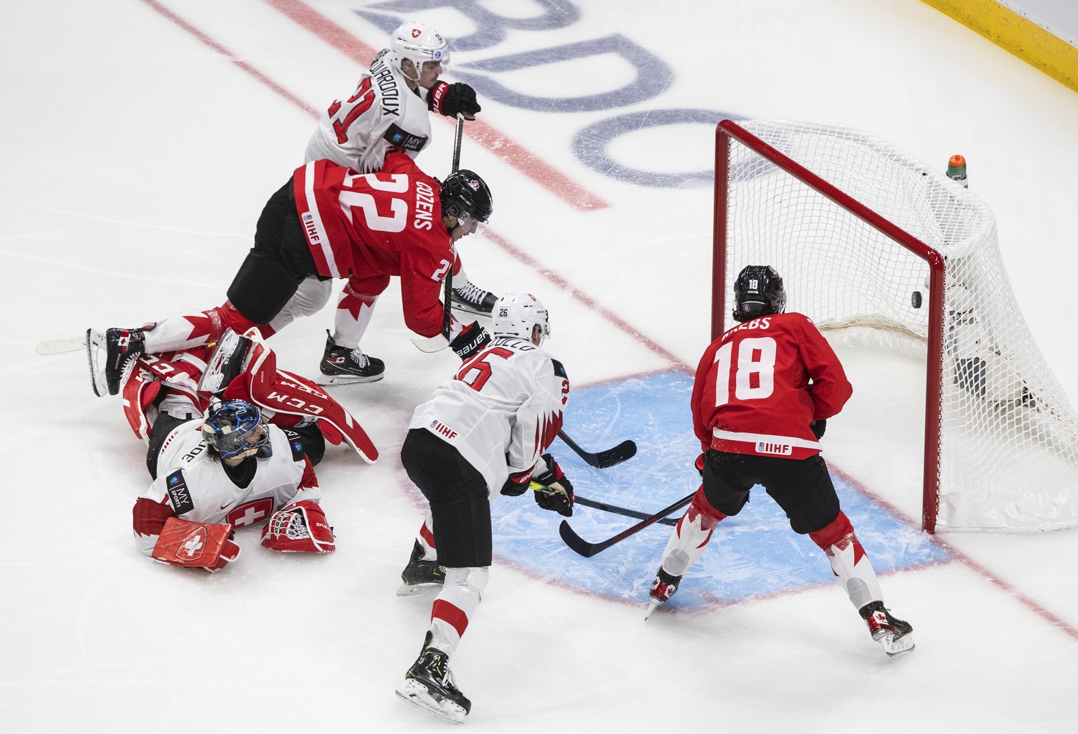 Canada&#039;s Dylan Cozens (22) scores a goal on Switzerland goalie Noah Patenaude (1) during the second period of an IIHF World Junior Hockey Championship game Tuesday, Dec. 29, 2020, in Edmonton, Al ...