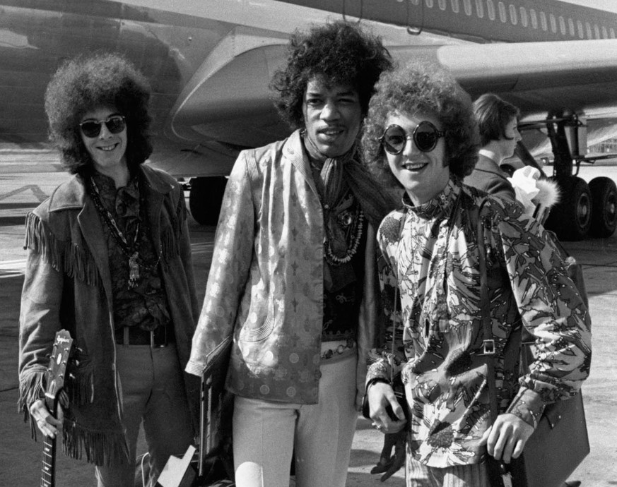 FILE - This Aug. 21, 1967 file photo shows bass guitarist Noel Redding, left, guitarist Jimi Hendrix, center, and drummer Mitch Mitchell, of the Jimi Hendrix Experience, at Heathrow airport in London. ...