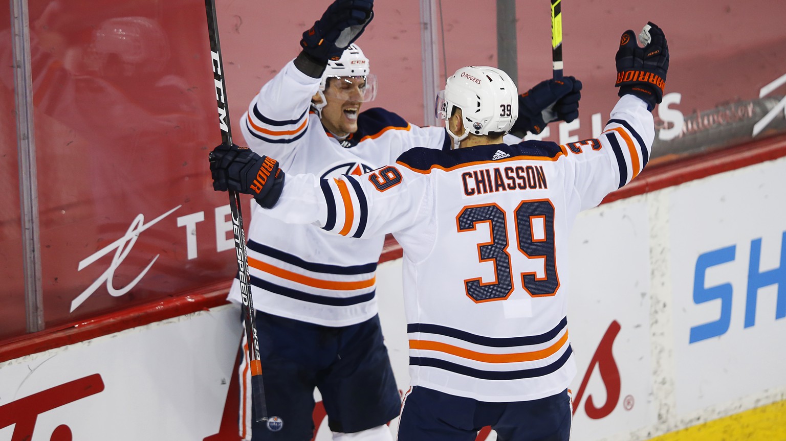 Edmonton Oilers&#039; Gaetan Haas, left, celebrates his goal with teammate Alex Chiasson (39) against the Calgary Flames during the second period of an NHL hockey game, Friday, Feb. 19, 2021 in Calgar ...
