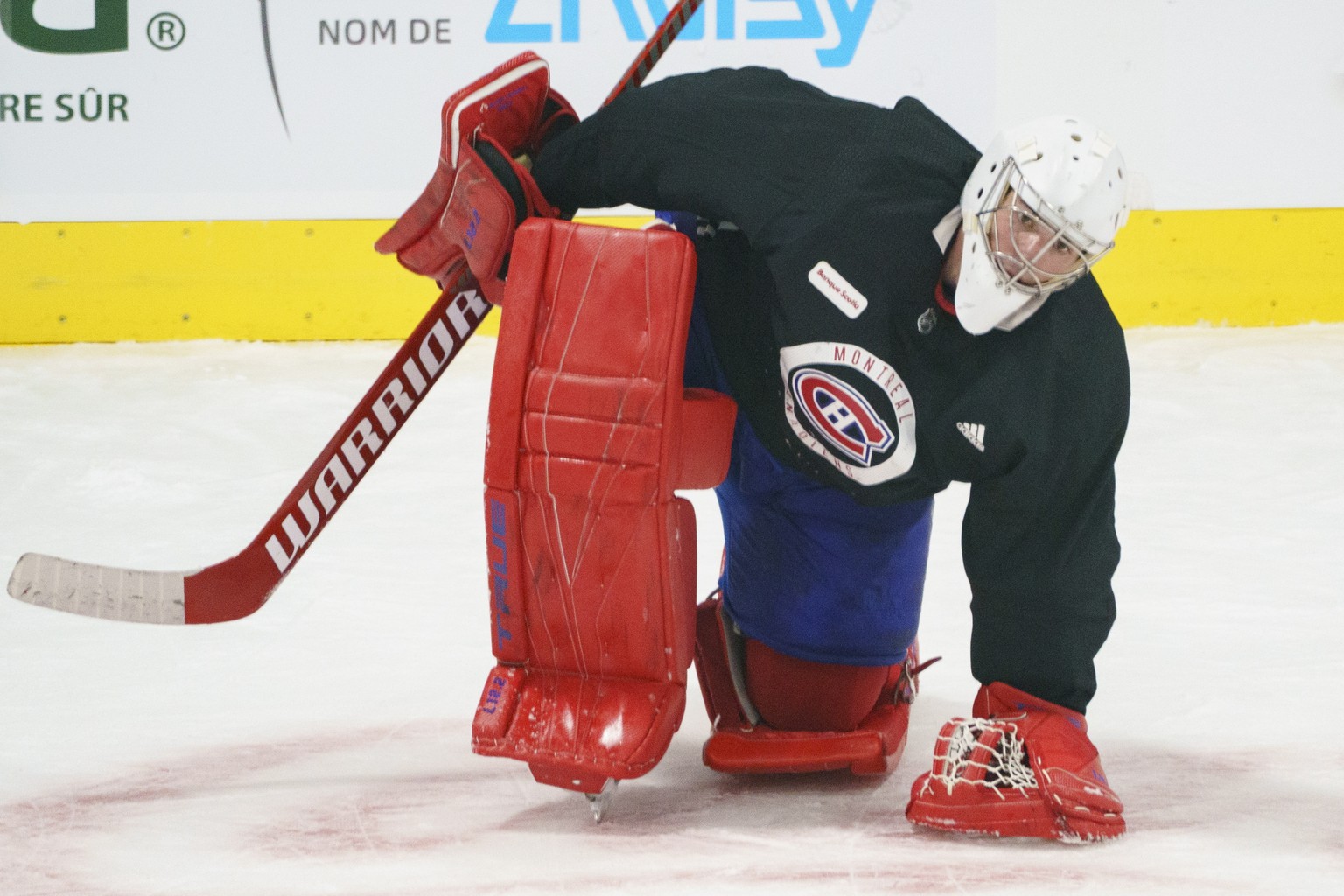 Montreal Canadiens goaltender Carey Price stretches during an NHL hockey practice in Brossard, Quebec, Tuesday, Jan. 5, 2021. (Paul Chiasson/The Canadian Press via AP)