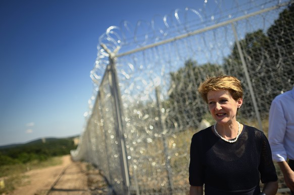 epa04303905 Switzerland&#039;s Justice minister Simonetta Sommaruga stands in front of a newlt installed security fence at the border between Turkey and Bulgaria during her visit in the town of Elhovo ...