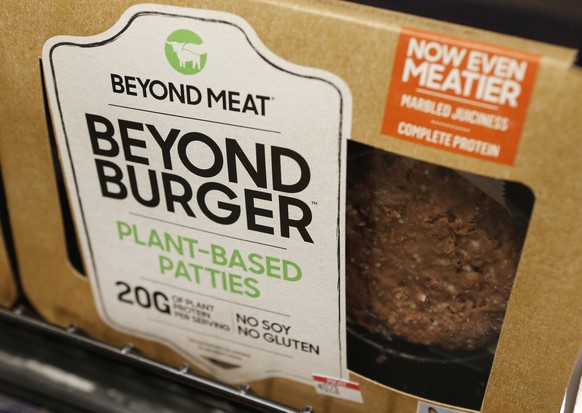 FILE - In this June 27, 2019, file photo a meatless burger patty called Beyond Burger made by Beyond Meat is displayed at a grocery store in Richmond, Va. Shares of Beyond Meat are tumbling in Thursda ...