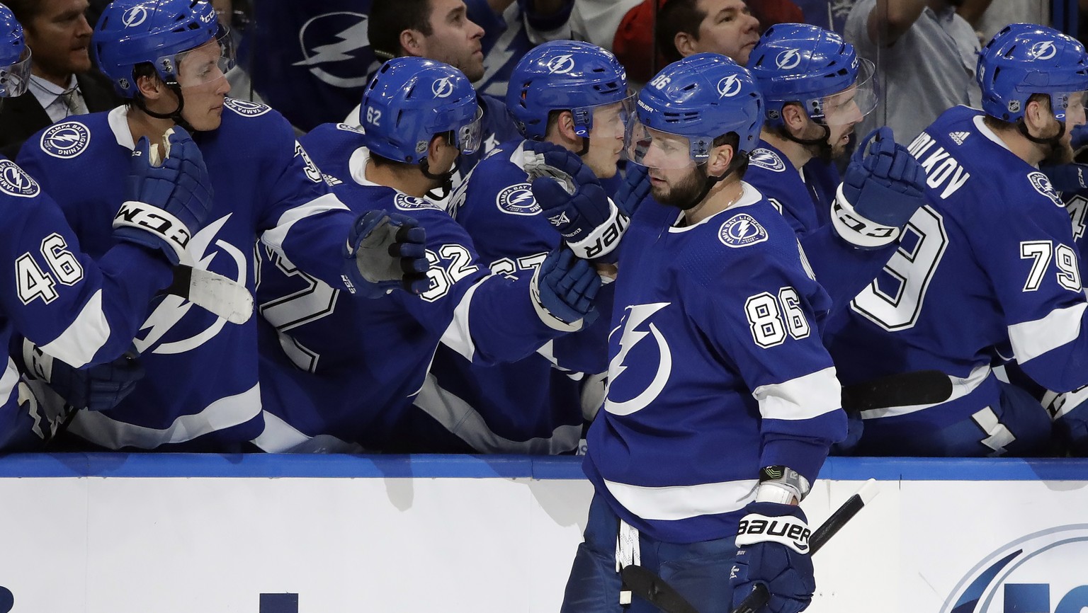 Tampa Bay Lightning right wing Nikita Kucherov (86) celebrates with the bench after scoring against the Nashville Predators during the third period of an NHL preseason hockey game Friday, Sept. 20, 20 ...