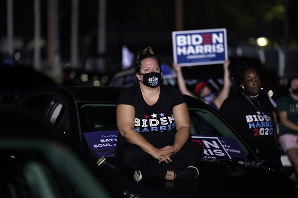 Supporters listen as Democratic presidential candidate former Vice President Joe Biden speaks at a drive-in rally at the Florida State Fairgrounds, Thursday, Oct. 29, 2020, in Tampa, Fla. (AP Photo/An ...